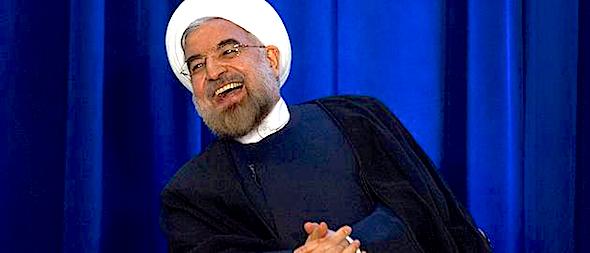 Iran's President Hassan Rouhani laughs as he speaks during an event hosted by the Council on Foreign Relations and the Asia Society in New York, September 26, 2013.  REUTERS/Keith Bedford (