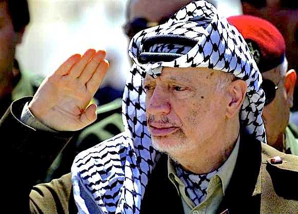 Palestinian President Yasser Arafat reviews an honour guard on his arrival at the Gaza Strip.  Reuters/Suhaib Salem/Files