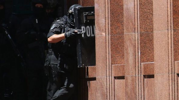 Armed police patrol the vicinity at Lindt Cafe, Martin Place on Dec. 15, 2014 in Sydney, Australia. Don Arnold/Getty Images