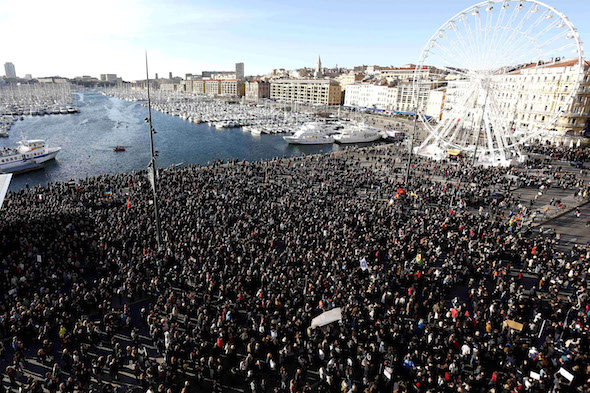 Several thousand people gather to pay tribute to victims of a shooting by gunmen at the office of the satirical weekly newspaper Charlie Hebdo during a demonstration in Marseille
