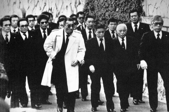 Top members of the Yamaguchi-gumi arrive in Kobe in 1988 for the funeral for their boss, Masahisa Takenaka, who was killed by a splinter group’s gunman. Photo: Associated Press