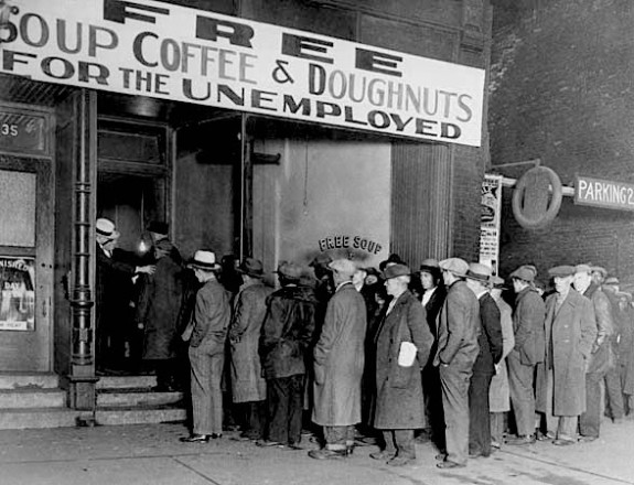16 Nov 1930, Chicago, Illinois, USA --- Notorious gangster Al Capone attempts to help unemployed men with his soup kitchen "Big Al's Kitchen for the Needy."  The kitchen provides three meals a day consisting of soup with meat, bread, coffee, and doughnuts, feeding about 3500 people daily at a cost of $300 per day. --- Image by © Bettmann/CORBIS