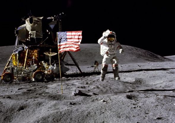 In this April 1972 photo made available by NASA, John Young salutes the U.S. flag at the Descartes landing site on the moon during the first Apollo 16 extravehicular activity. NASA says the astronaut, who walked on the moon and later commanded the first space shuttle flight, died on Friday, Jan. 5, 2018. He was 87. (Charles M. Duke Jr./NASA via AP)